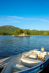 Fototapeta na wymiar blue boat on a dock ready to go on the lake