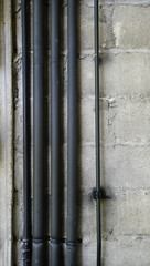 metal wire pipes on the concrete wall. loft style