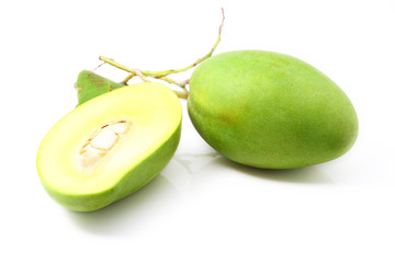 Green mangoes with leaves isolated on a white background