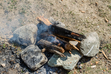 bonfire among picnic stones