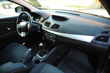 Fototapeta na wymiar interior of a modern car. Black dashboard 
