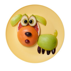 Surprised fruit dog made on yellow plate