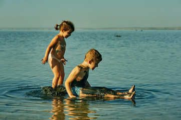 children take mud baths at the resort and having fun with mud . children in the Spa
