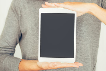 Cool girl holding digital tablet