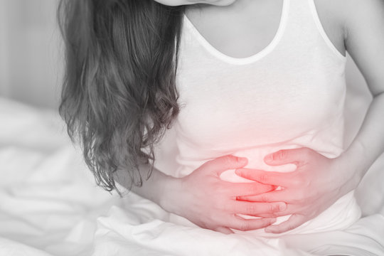 Woman having stomachache. Sickness concept.
