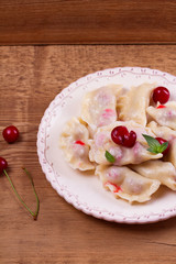 Dumplings, filled with cherries. Varenyky, vareniki, pierogi, pyrohy - popular dish in East Europe....