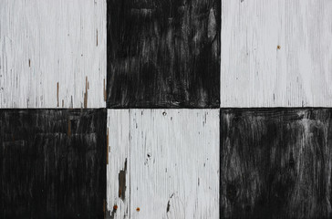 black and white tiles pattern painted on wood texture
