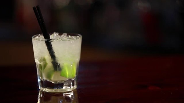 Caipiroska coktail is on the bar.