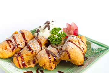 Thai dessert Deep fried banana with whipping cream and chocolate sauce