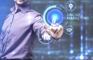The concept of business, technology, the Internet and the network. A young entrepreneur working on a virtual screen of the future and sees the inscription: Online marketing