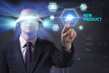 Business, Technology, Internet and network concept. Young businessman working in virtual reality glasses sees the inscription: New product