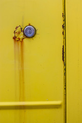 old vintage yellow car door with rust