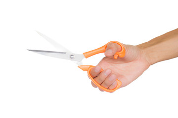 Hand holding open scissors isolated on white background with clipping path.