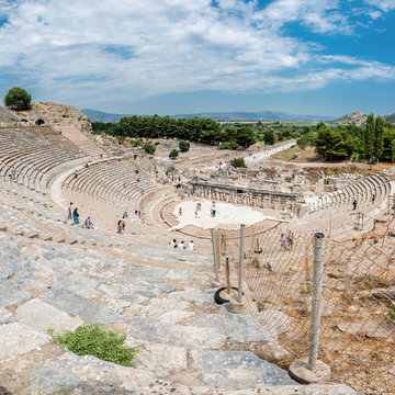 People visit Amphitheatre (Coliseum) at Ephesus historical ancient city, in Selcuk.High Resolution panoramic view.Izmir,Turkey:20 August 2017