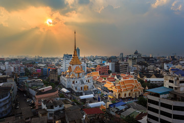 Aerial view cityscape & Sunbeam Wat Traimit (Thai Temple) Inside of there have Golden Buddha that the biggest in the world in chinatown or yaowarat area in bangkok, Thailand.