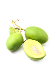 Green mangoes with leaves isolated on a white background