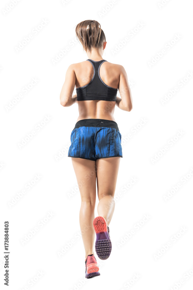 Sticker Backside view of fit female jogger jogging movement. Full body length portrait isolated on white studio background.