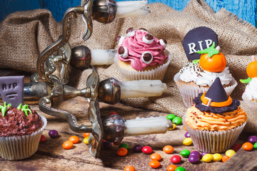 Halloween cupcakes with colored decorations