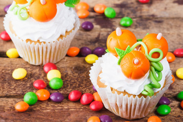Halloween cupcakes with colored decorations