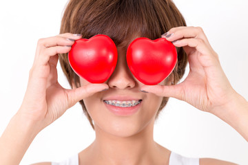 Beautiful young asia woman with red hearts. Isolated on white background. Studio lighting. Concept for healthy.