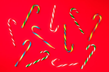 Christmas Candy Canes on red background close-up