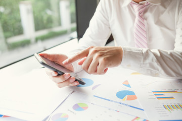 Young businessman working with mobile phone