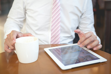 Young businessman working with tablet