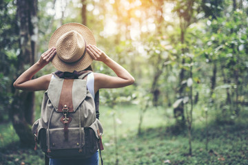 happy female tourist to travel in wild trip  hiking during vacation.Travel concept.