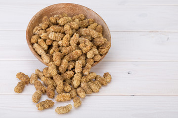 Dried White Mulberries Fruits In A Wooden Bowl Isolated On White Wooden Background, A Healthy And Popular Sweet Snacks In Iran And Turkey