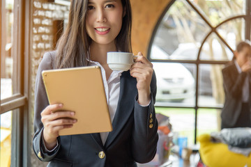 Fototapeta premium Happy young businesswoman after checking email during coffee break. Target Success. Reach the goal. Business concept.