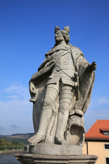 Fototapeta na wymiar Baroque Statue of Pippin (King of Franconia) on old Main Bridge in Wurzburg. Germany