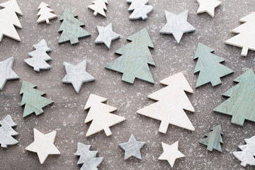 Christmas wooden decor on the snow background.