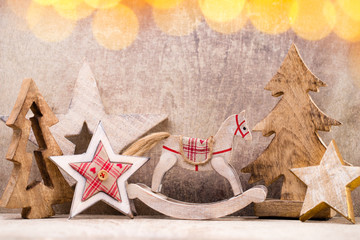 Christmas tree decorations on a wooden background. With bokeh ornaments.