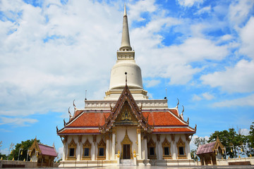 Fototapeta na wymiar Buddhist temple in suratthani ,thailand and blue sky with cloudy background