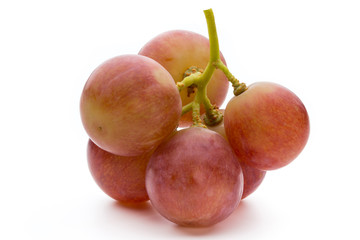 Ripe red grape isolated on white.