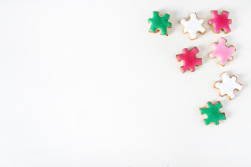 Cookies puzzle. Day of knowledge, school. Bright white backgroun