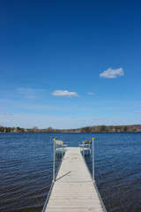 Fototapeta na wymiar dock on a lake on blue sky