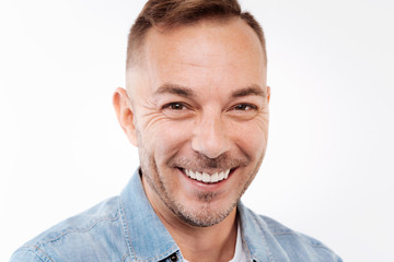 Close up of happy young man smiling