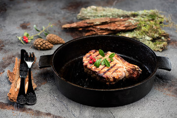 Grilled fillet beef steak on a cast-iron frying pan