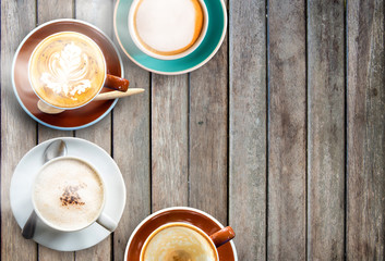  Cup of coffee and smoke on wooden desk table background.