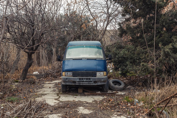 Abandoned old car on street