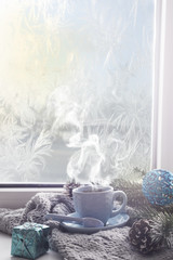 Obraz na płótnie Canvas cozy soft gray blanket with a cup of coffee