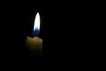 Candle in black background