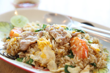 Pork fried rice with lime on wood background , Thai food