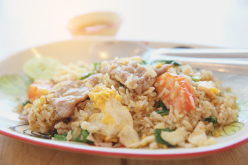 Pork fried rice with lime on wood background , Thai food