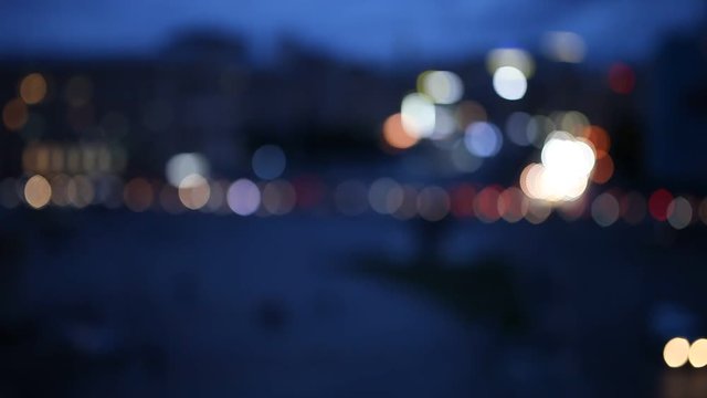 Out of focus background with blurry unfocused car and city light
