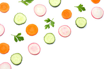 mix of sliced cucumber with sliced carrot isolated on a white background top view
