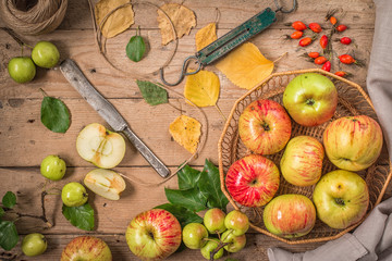 Green and red apples on rustic  table. Flat lay.