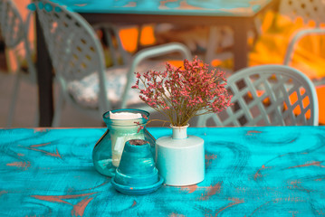Modern hipster style teal and orange table arrangement