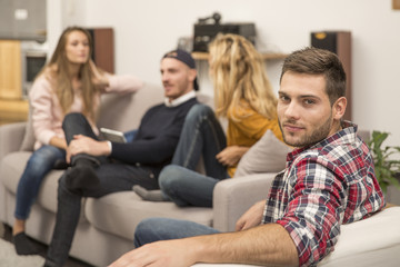 Obraz premium Portrait of handsome guy amongst group of friends